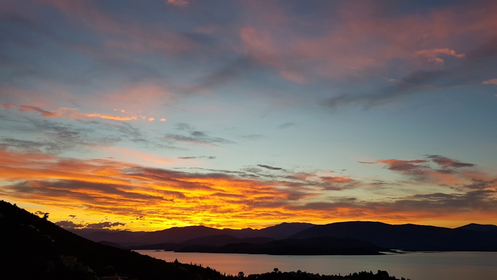 silhouette of mountain during sunset