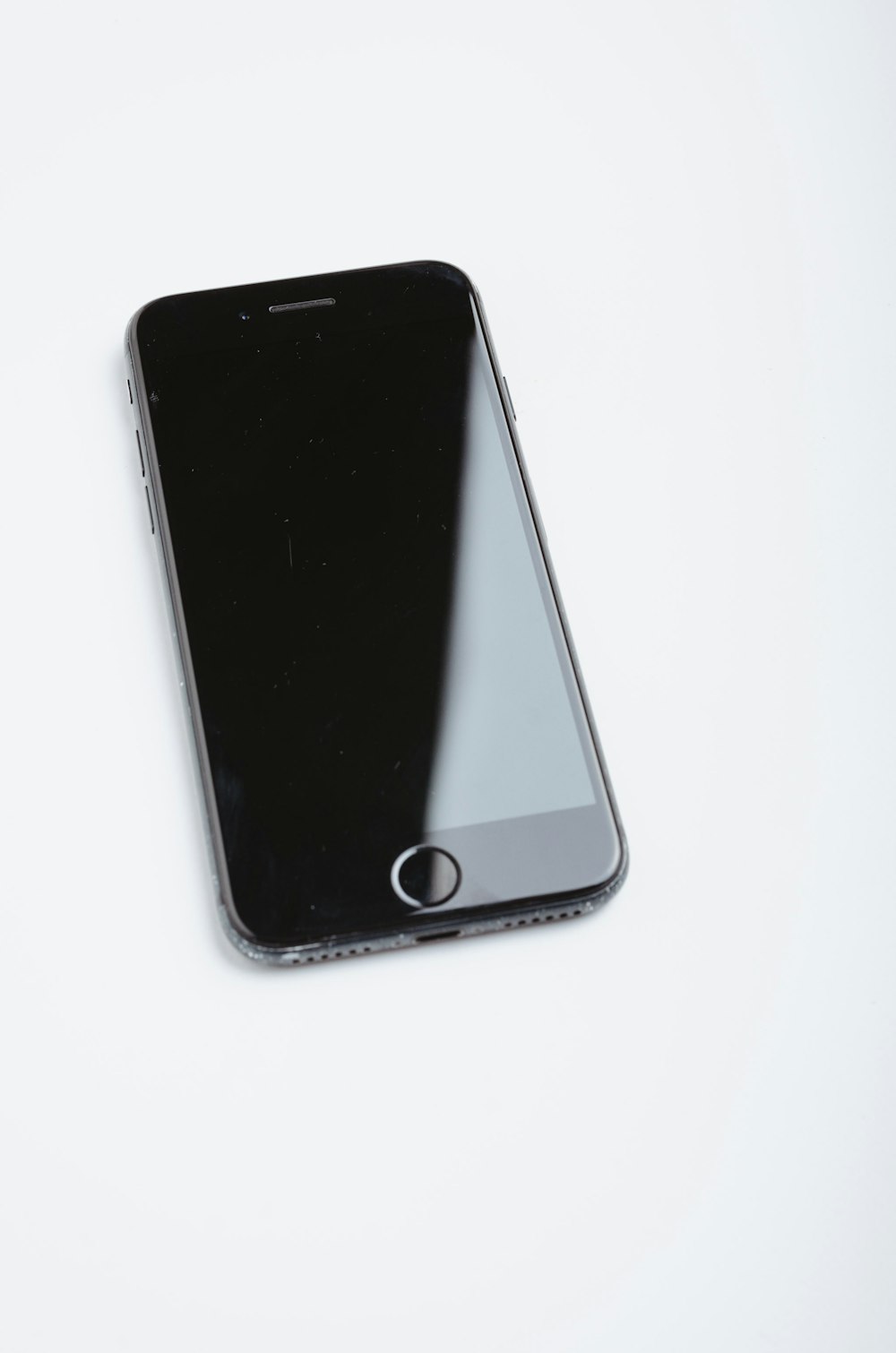 space gray iphone 6 on white surface