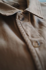brown button up collared shirt