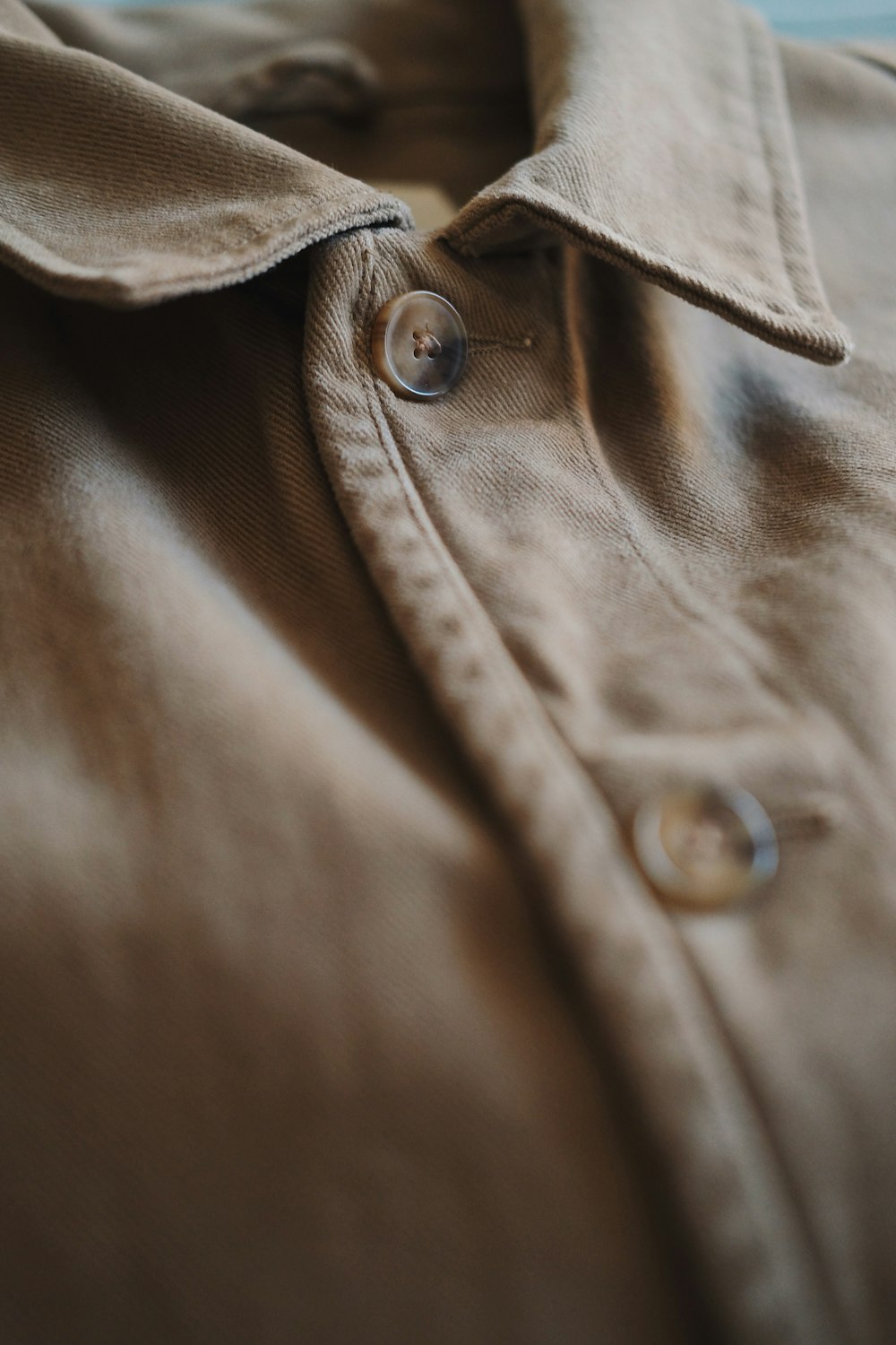 brown button up collared shirt