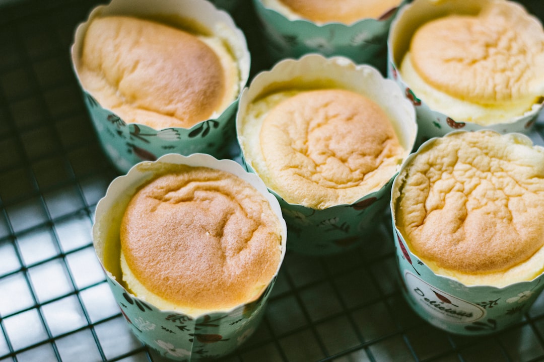 white and brown cupcakes on green ceramic bowl