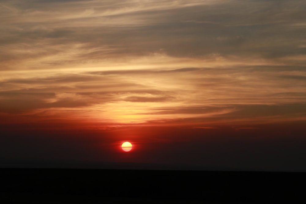 orange and grey clouds during sunset