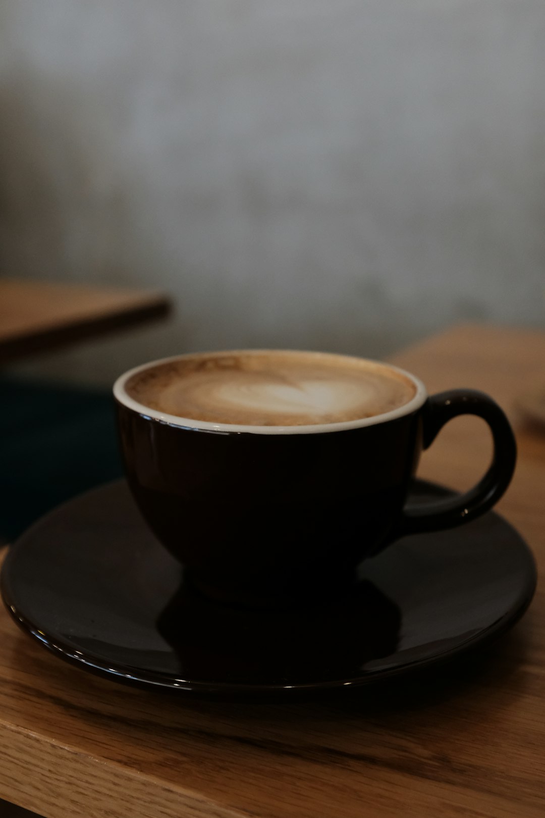 black ceramic cup on saucer