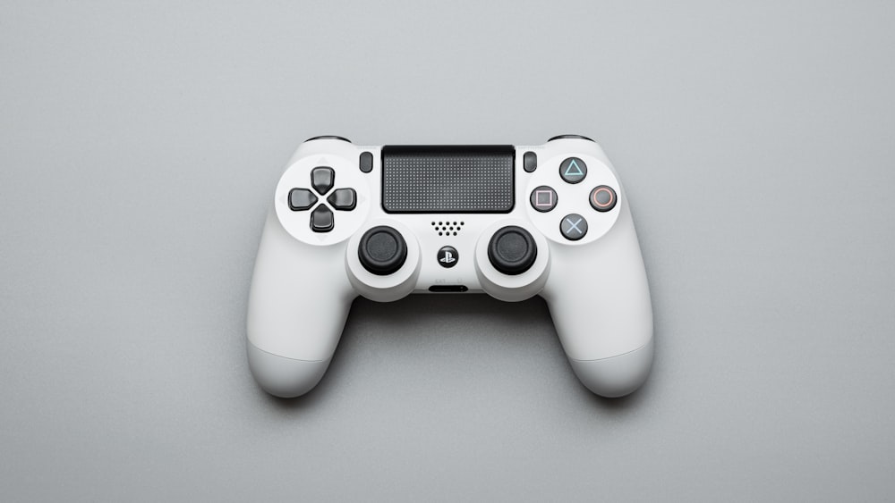 white and black game controller
