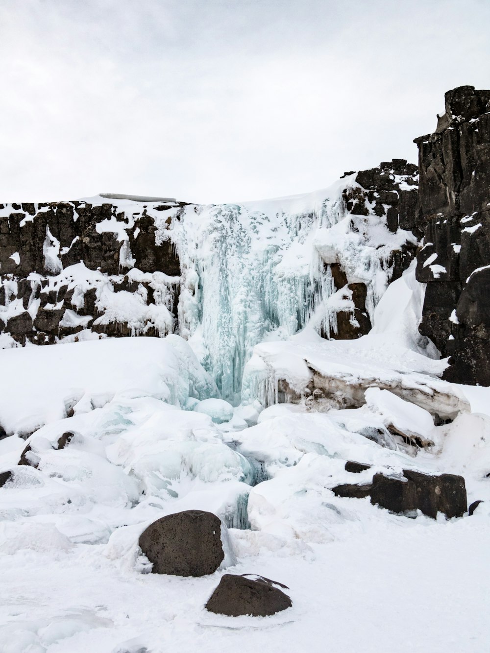 snow covered rocks and rocks