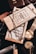 A close-up of stylish men's accessories displayed elegantly on a wooden table.