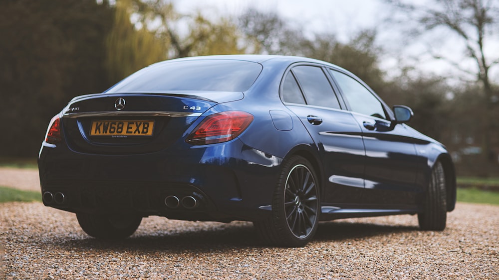 black honda sedan on brown soil