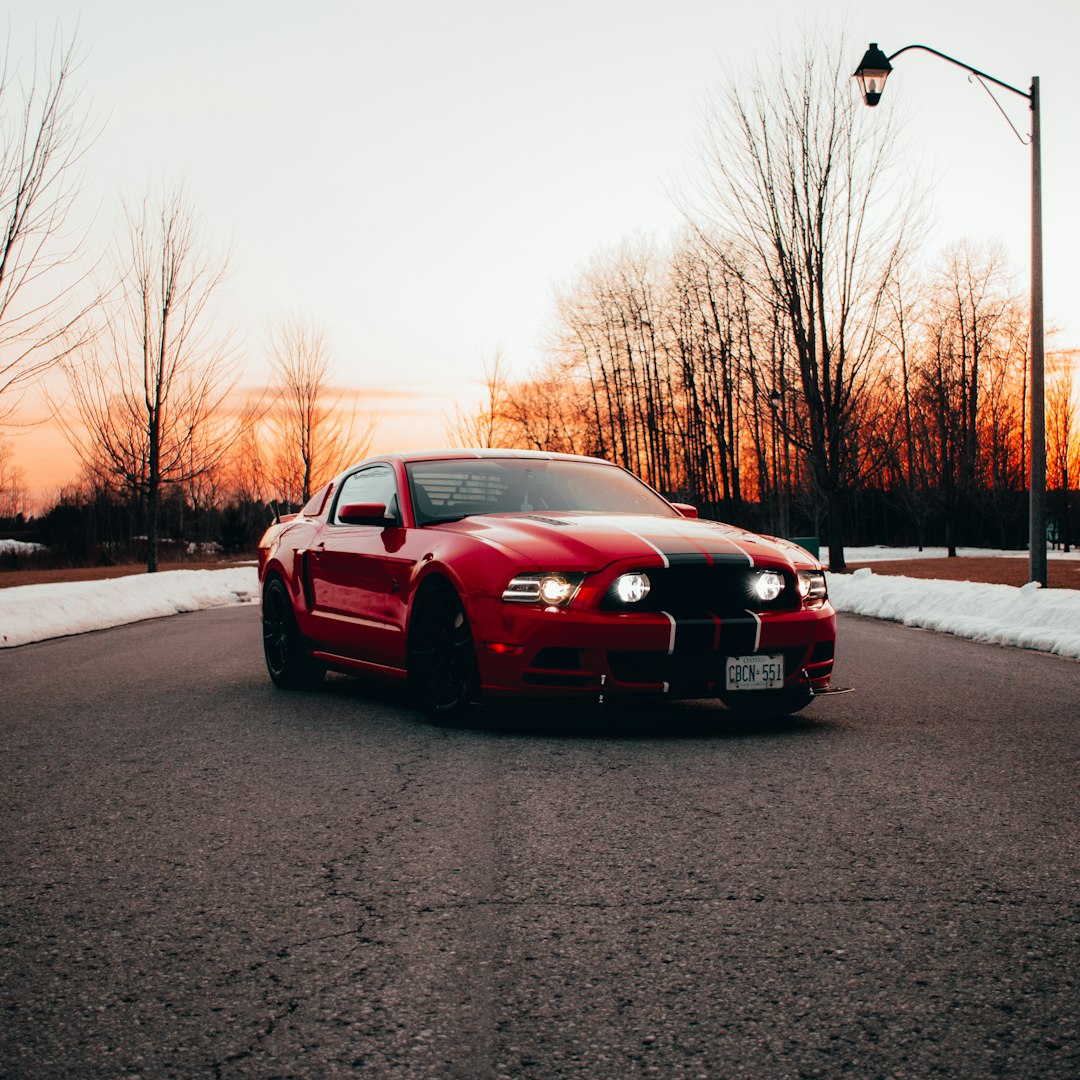 red bmw m 3 on road during daytime