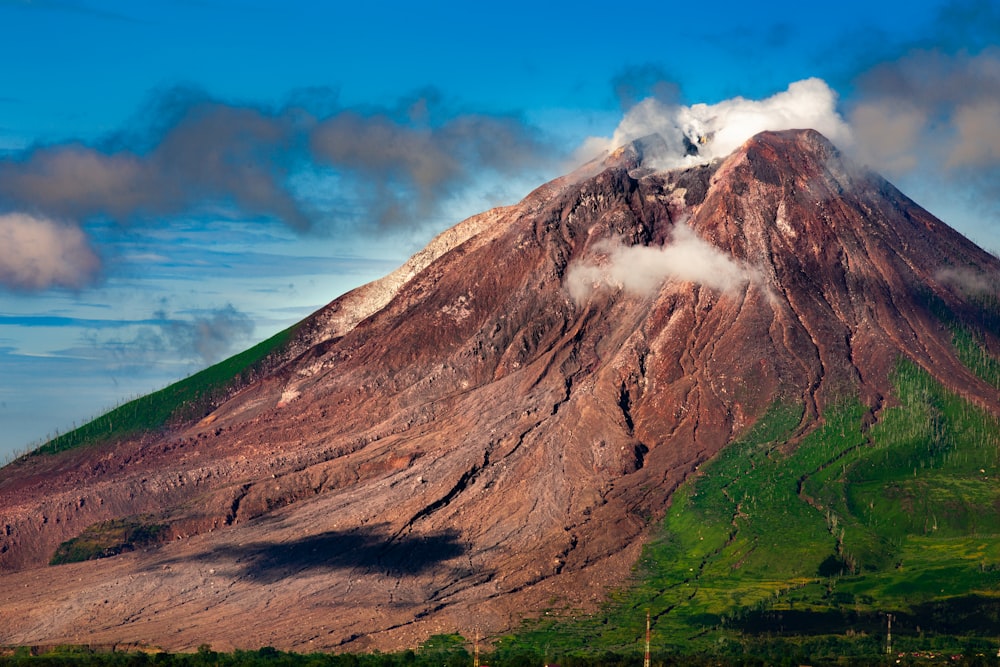 brown mountain under blue sky during daytime