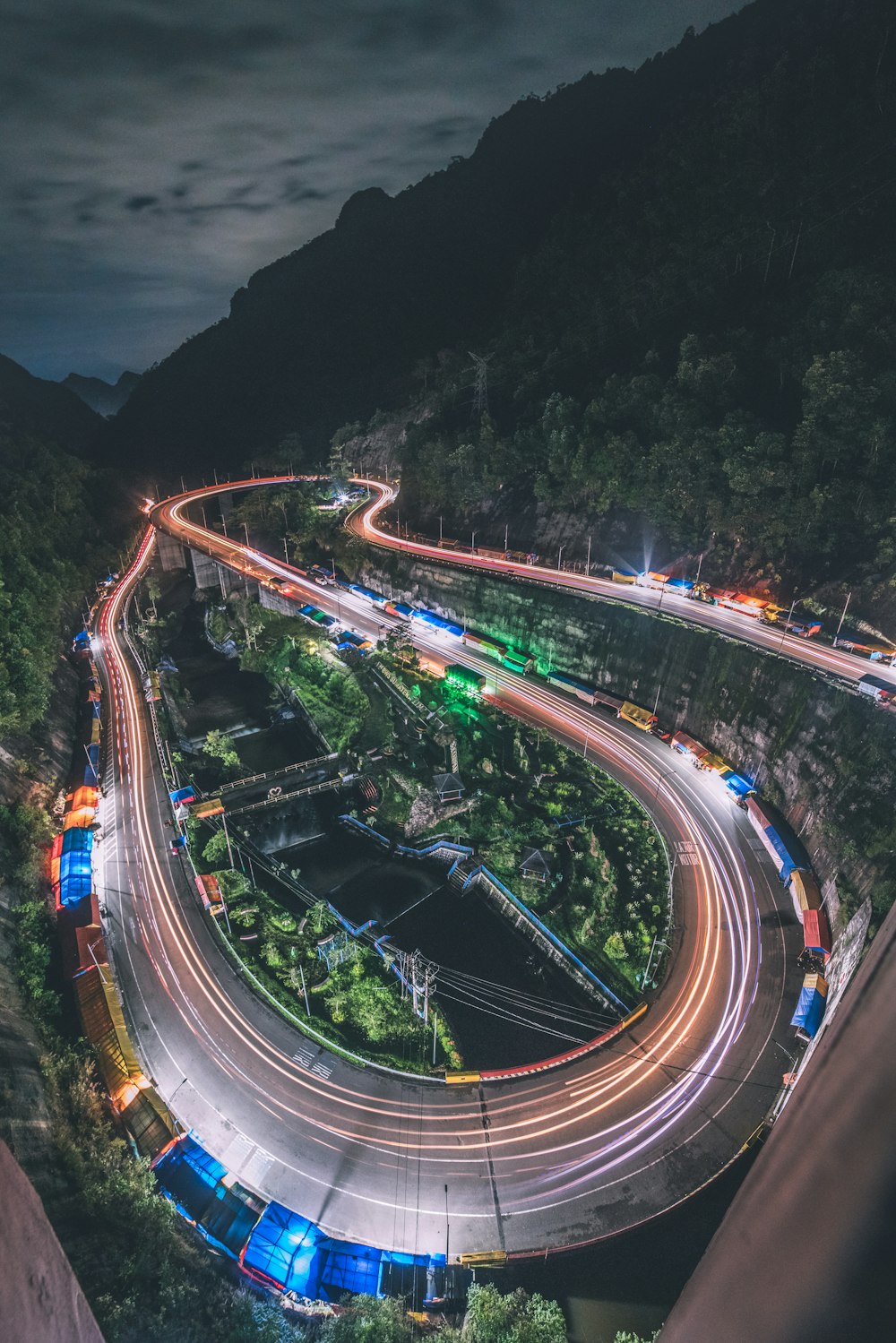 time lapse photography of cars on road during night time