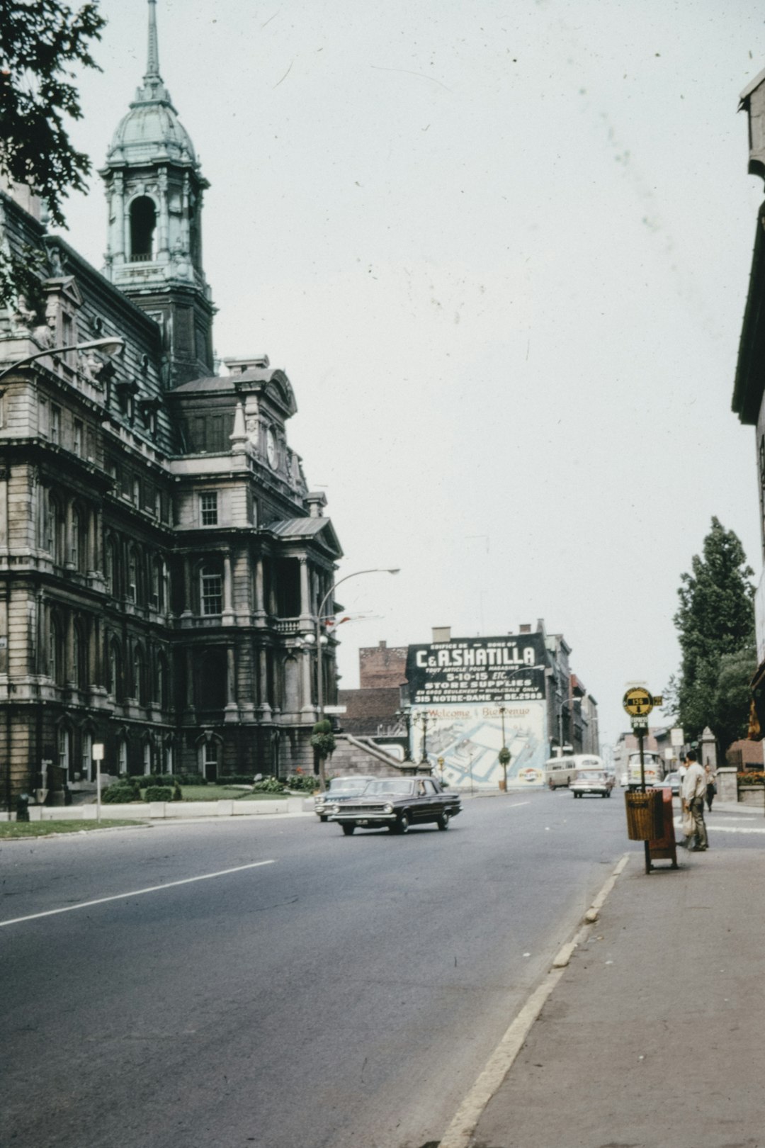 people walking on sidewalk near building during daytime