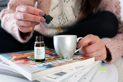 person holding white ceramic mug