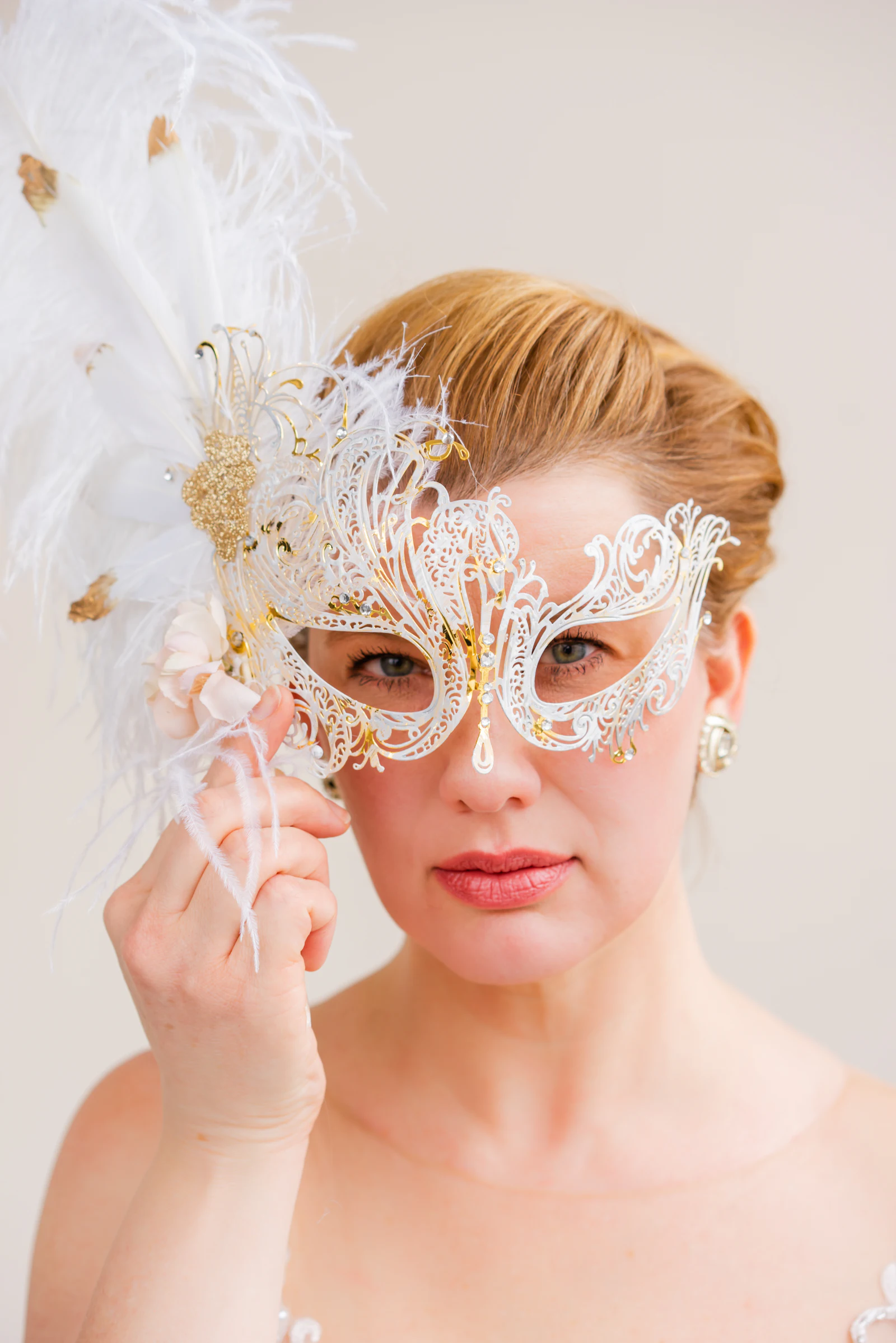 Woman wearing a masquerade mask
