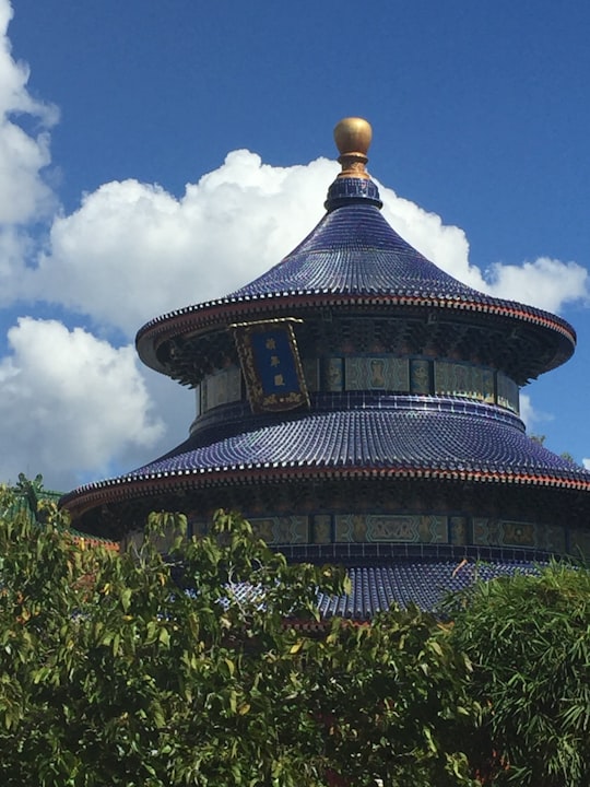 brown and blue temple under blue sky in Epcot United States