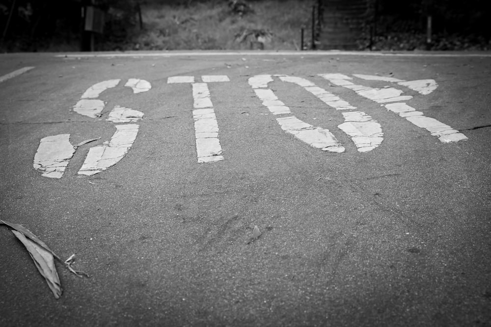 grayscale photo of a pedestrian lane