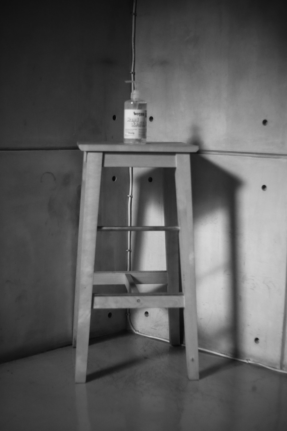 white plastic bottle on brown wooden table