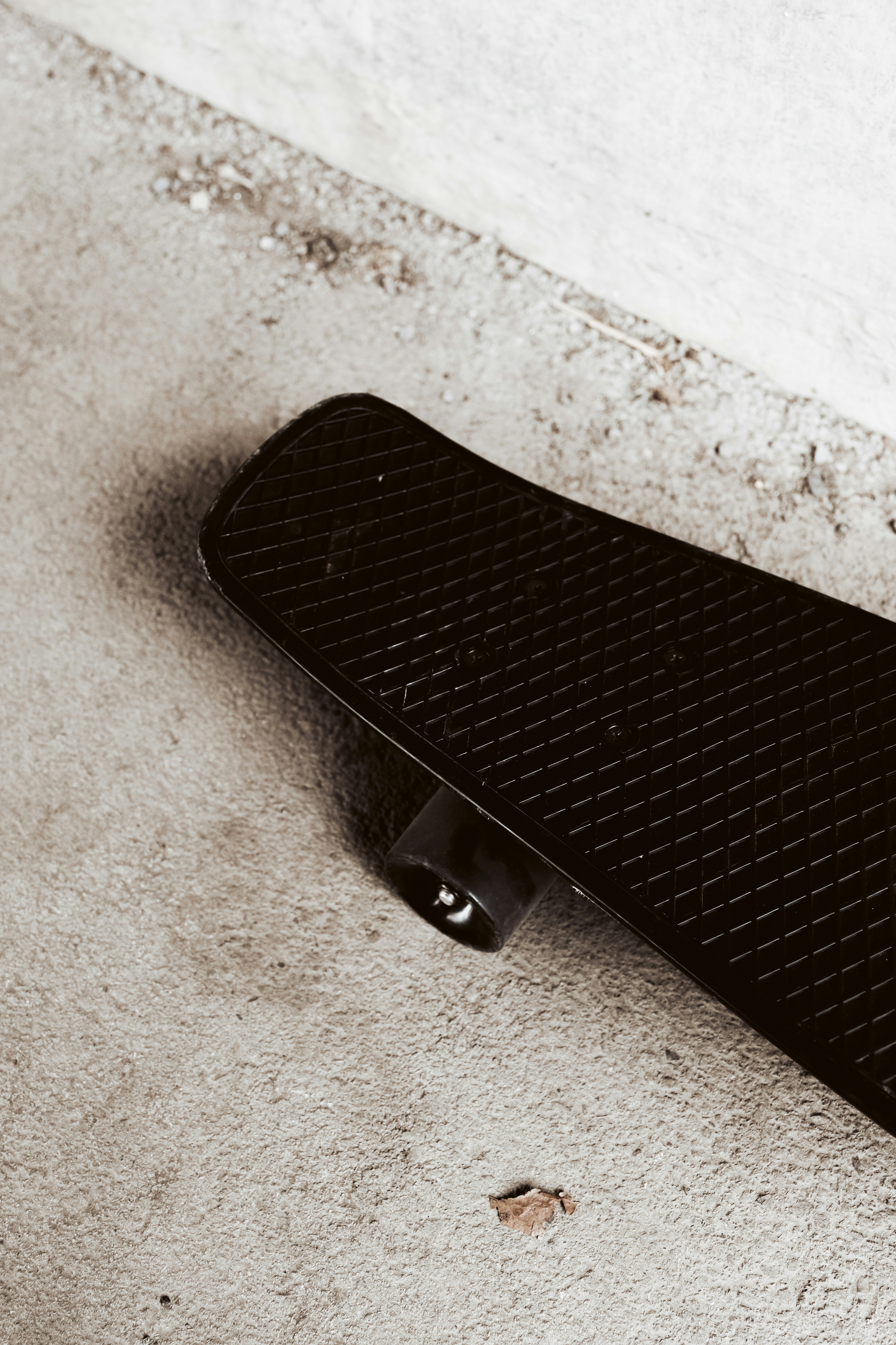 black iphone case on white textile