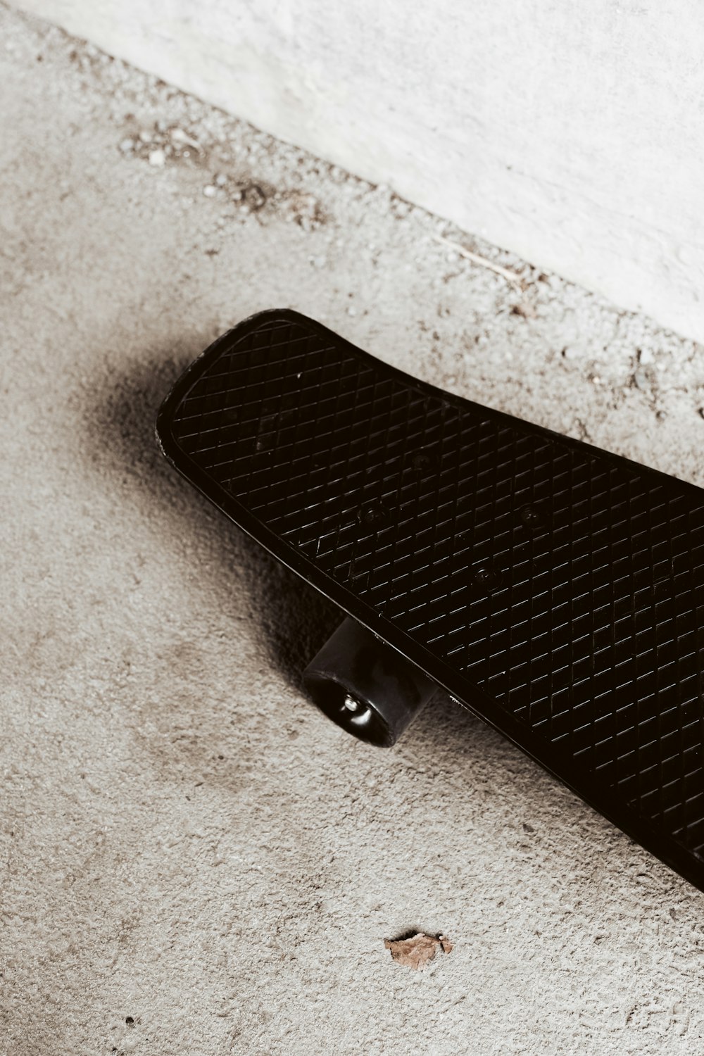 black iphone case on white textile