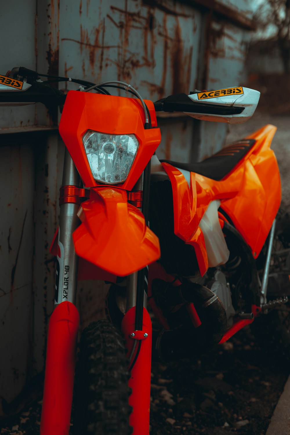 orange and black motorcycle helmet