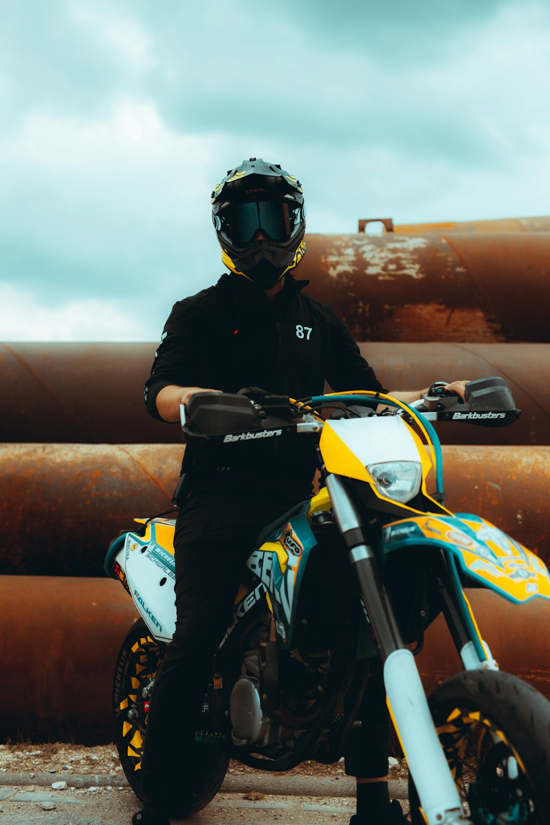 man in black jacket riding white motorcycle