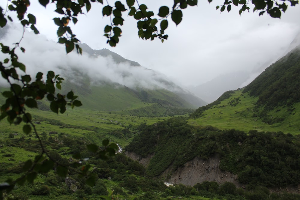 green mountains under white clouds during daytime