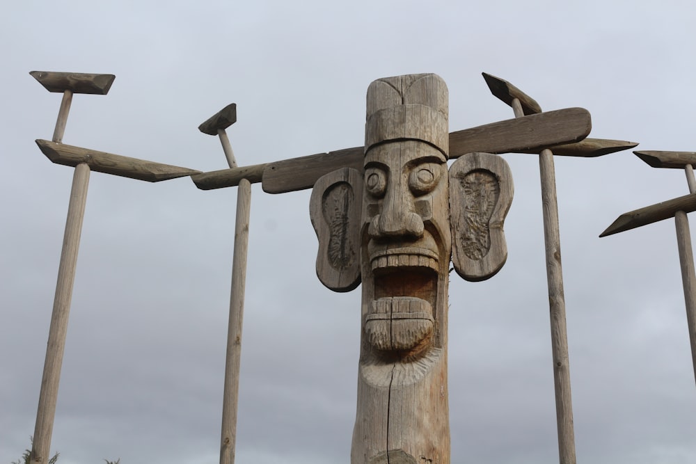 brown wooden cross with rope