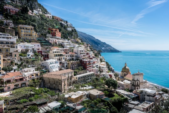 city near body of water during daytime in Amalfi Coast Italy