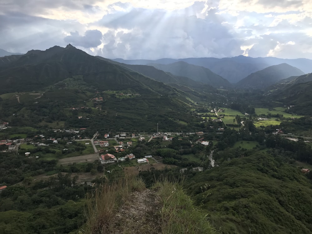 green mountains under white clouds during daytime