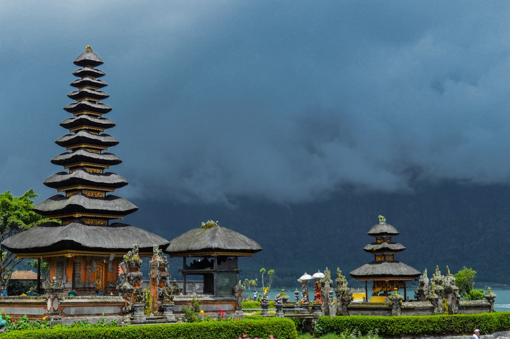 brown and white temple under gray clouds