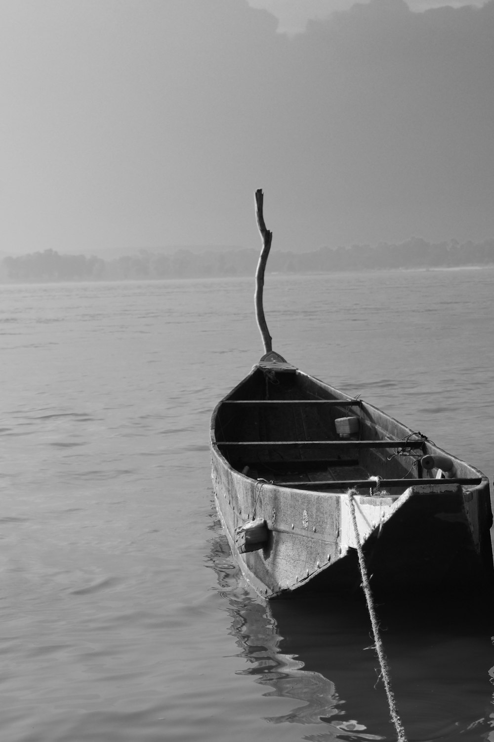 grayscale photo of boat on sea