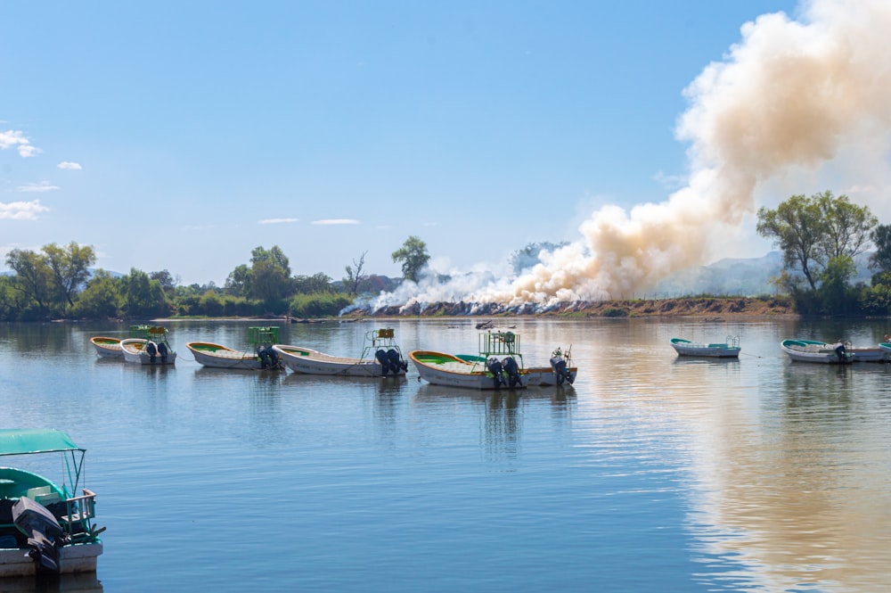 people riding on boat on water under blue sky during daytime