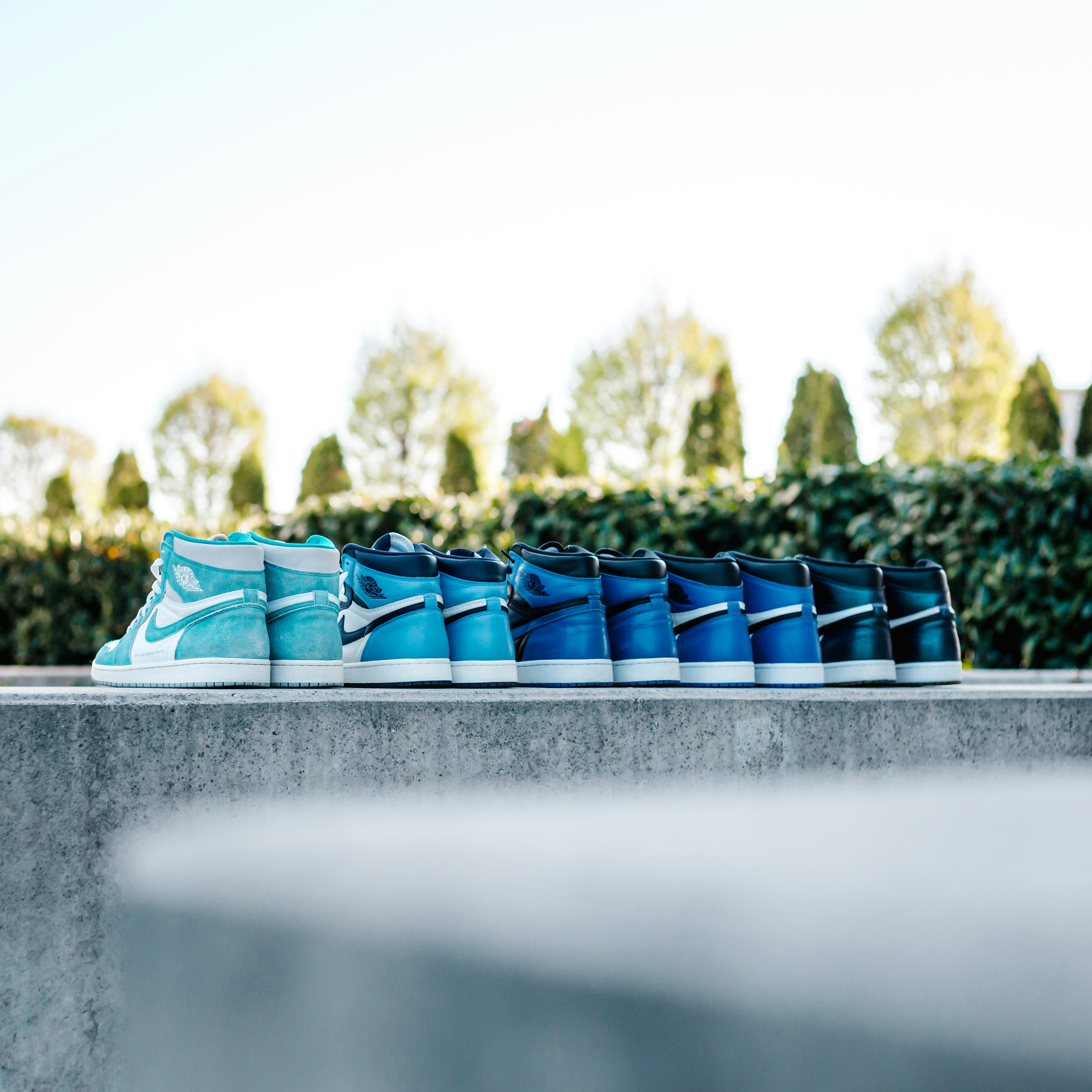 blue and black textile on gray concrete surface