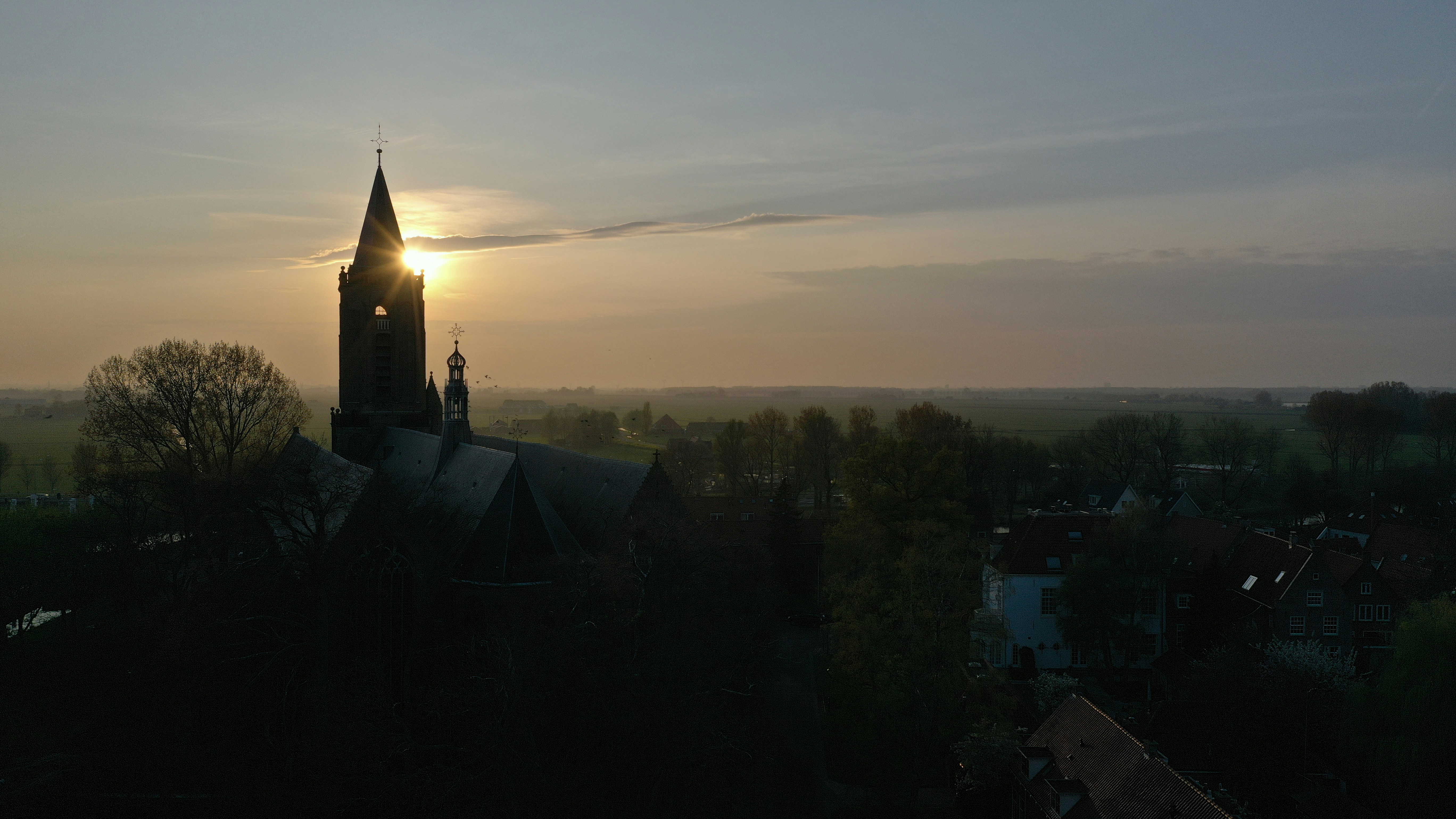 black and white concrete building during sunset
