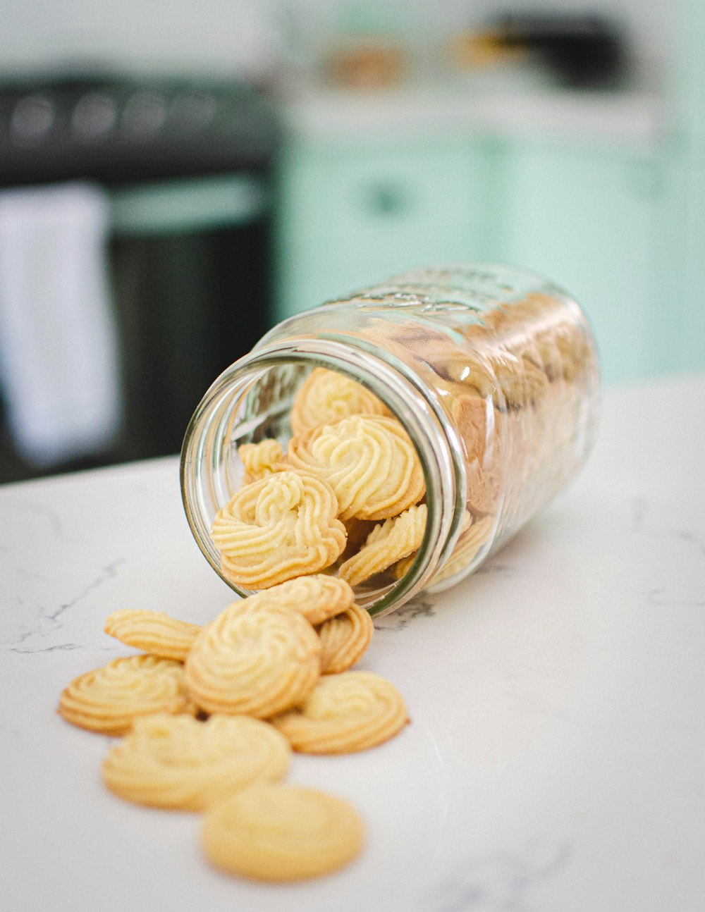 brown round medication pill on clear glass jar