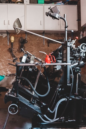 Technician assembling a custom hydraulic machine piping system