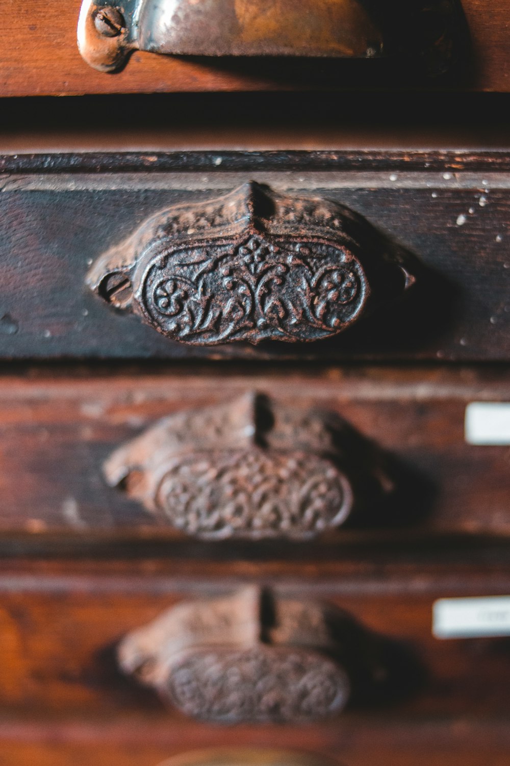 brown wooden drawer with silver door knob