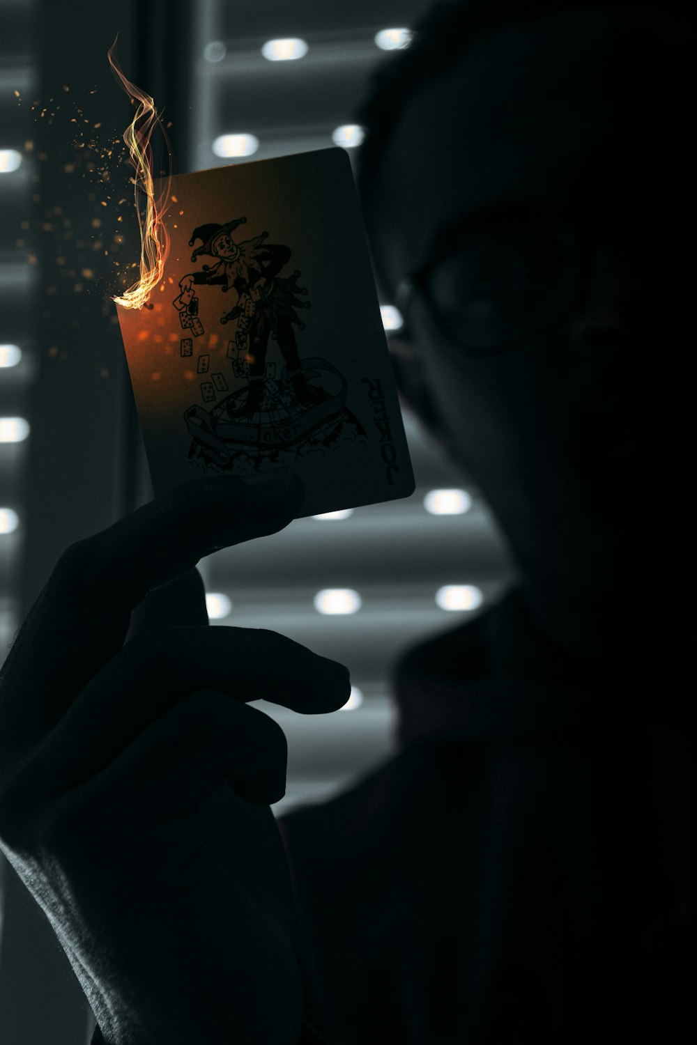 a person holding a lit up card in their hand