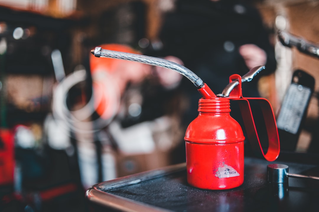 red and silver steel container on black table