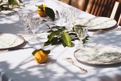 yellow fruit on white table cloth elegant teams background