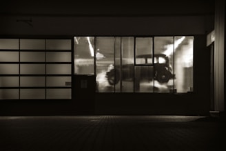 grayscale photo of glass window
