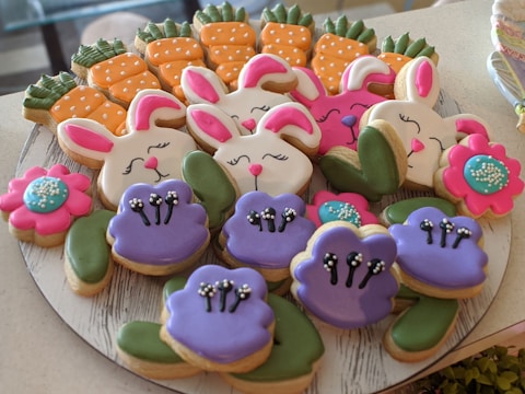 A tray of adorable animal-shaped cookies decorated with bright icing