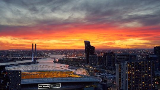 city skyline during orange sunset in Docklands VIC Australia