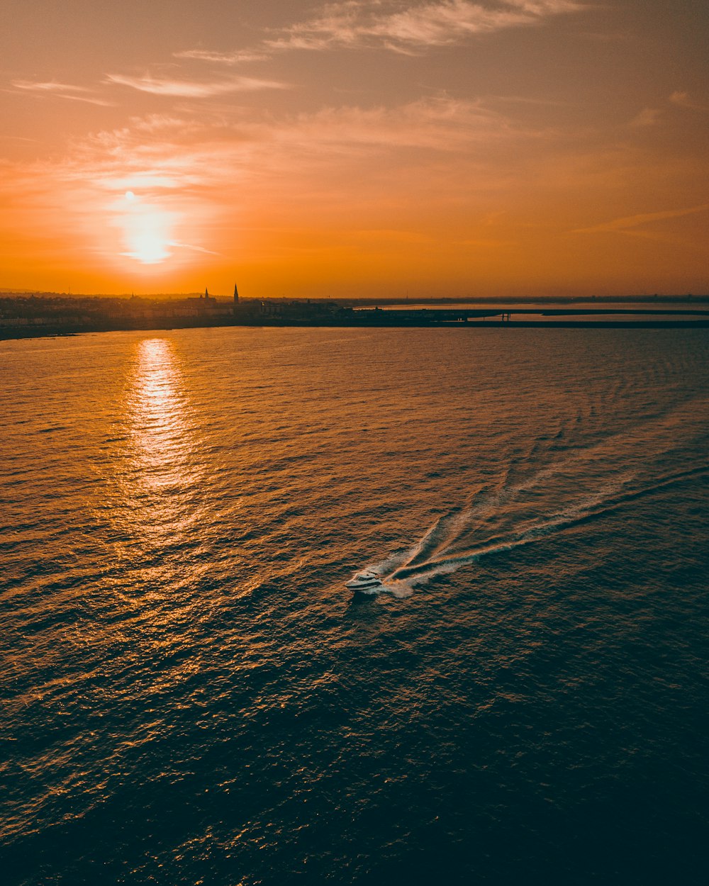 body of water during sunset