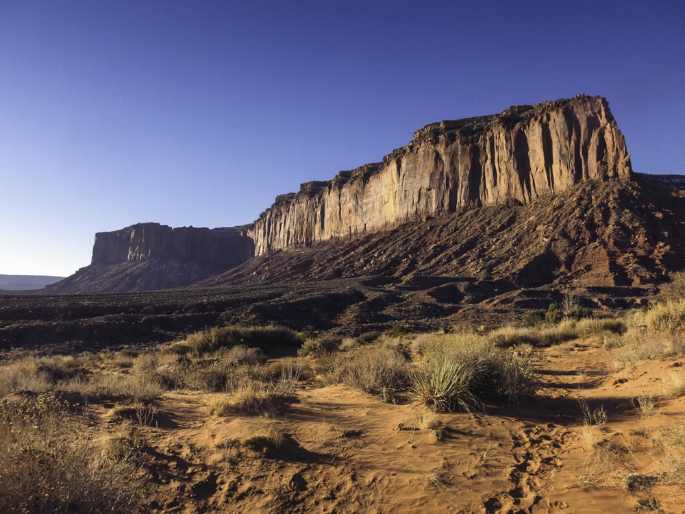 brown rocky mountain under blue sky during daytime