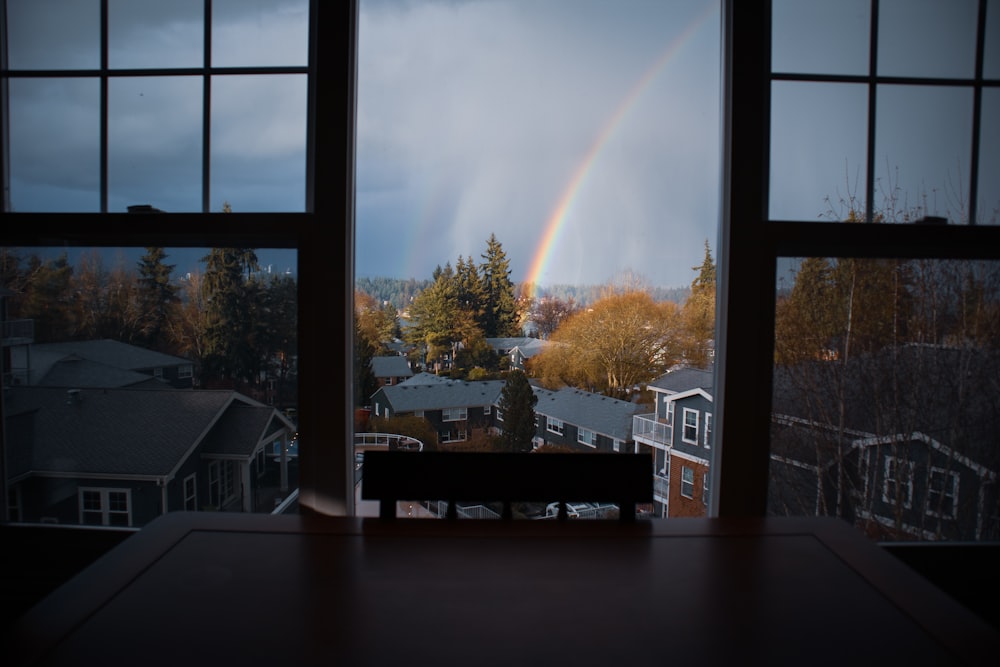 brown wooden table near window during daytime