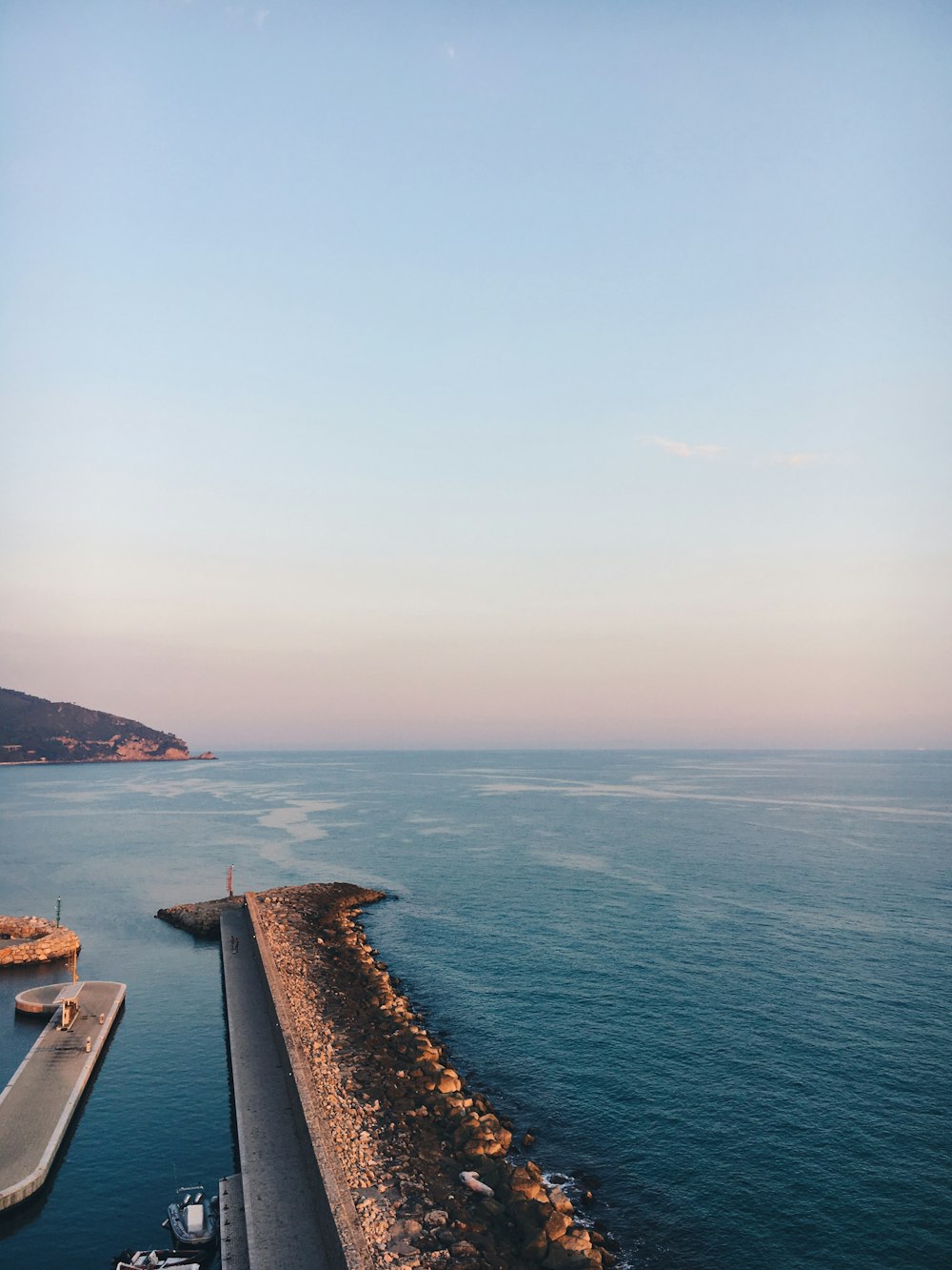 brown wooden dock on sea during daytime