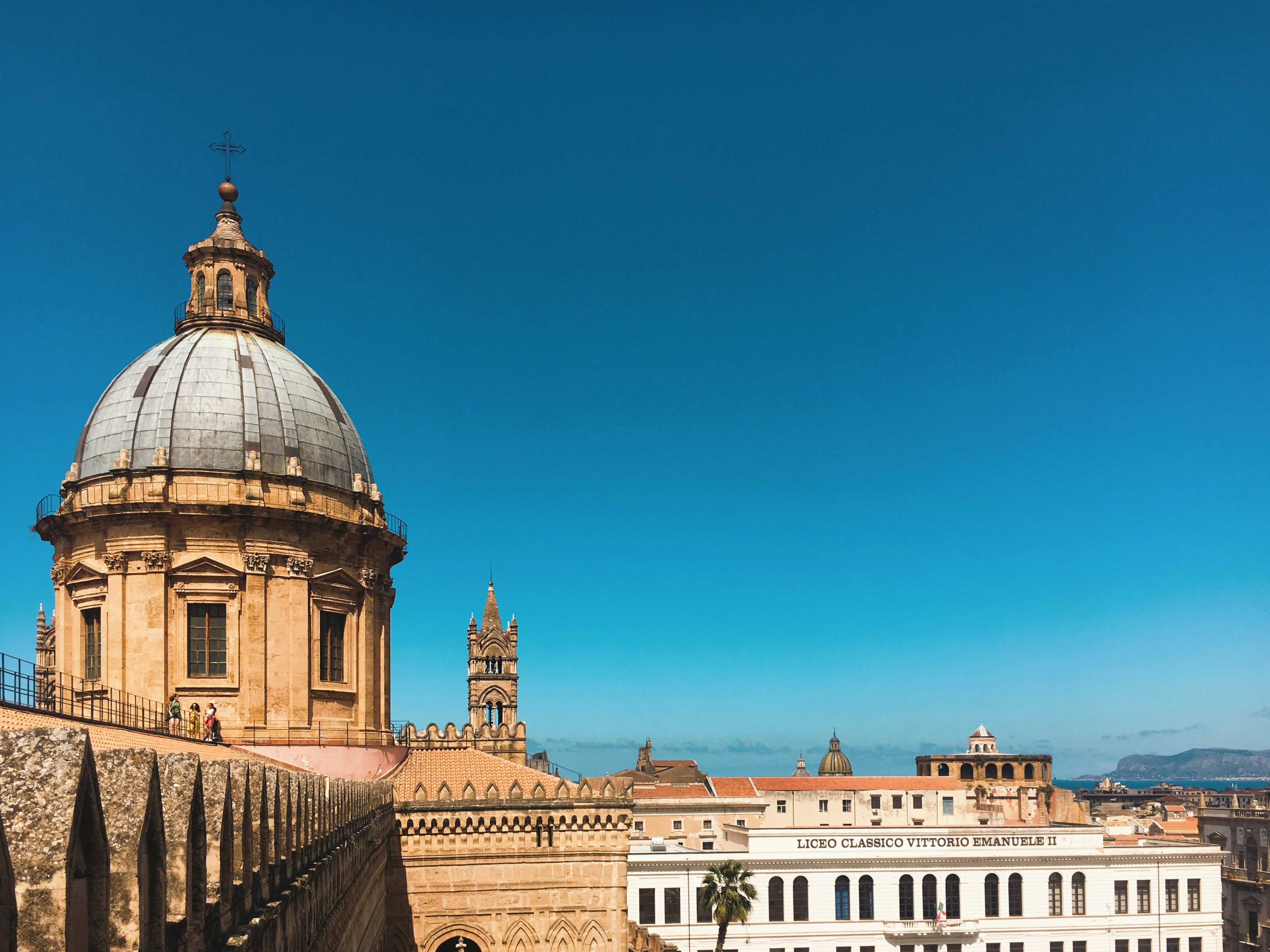 white and brown concrete building under blue sky during daytime, 