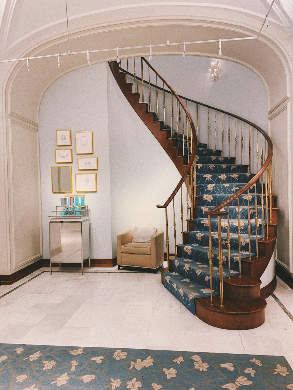 brown wooden spiral staircase on white ceramic tiles