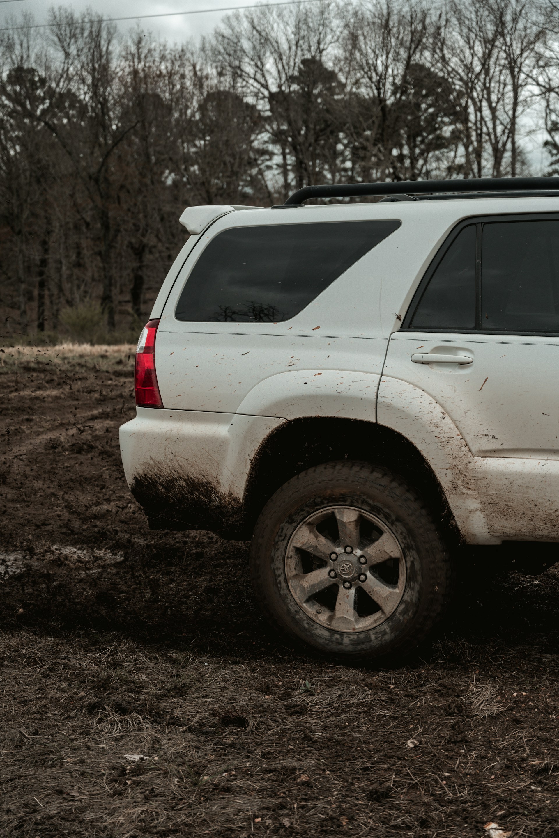 white suv on dirt road during daytime
