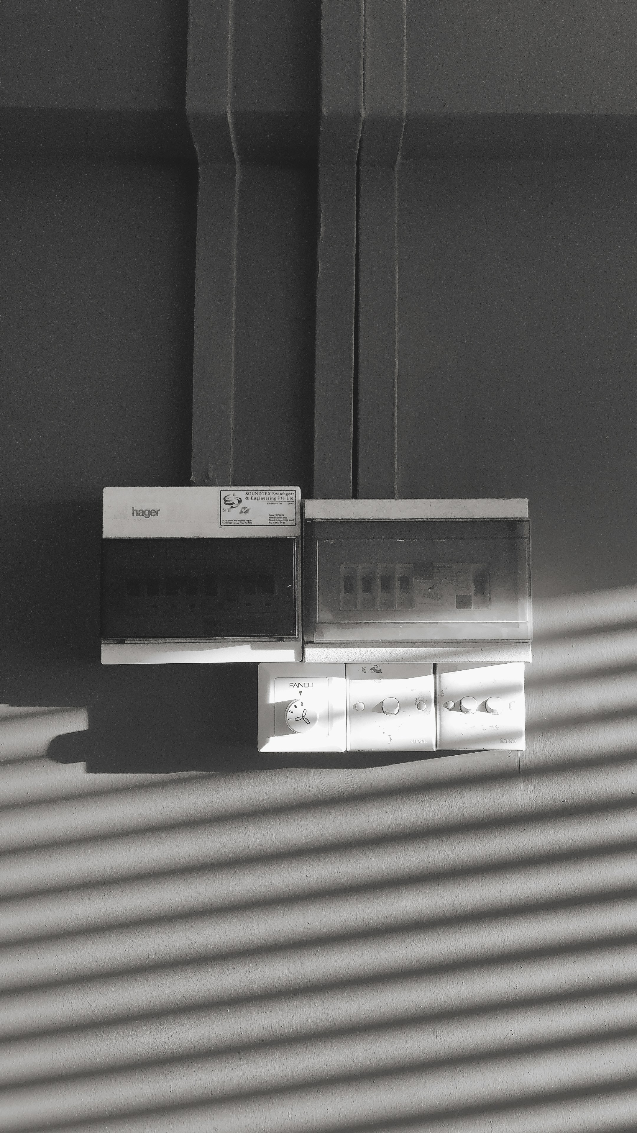 Residential electrical panel installation, dim utility room, shadowed background